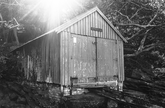 Shed by the Shore – Black & White Canvas Print